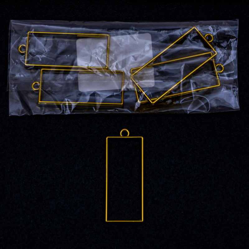 Dije rectangular en dorado 5pc