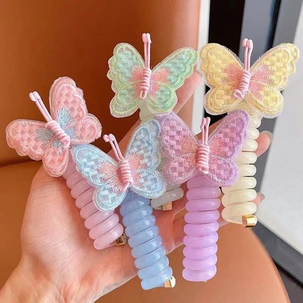 Banda elástica con aplique mariposa